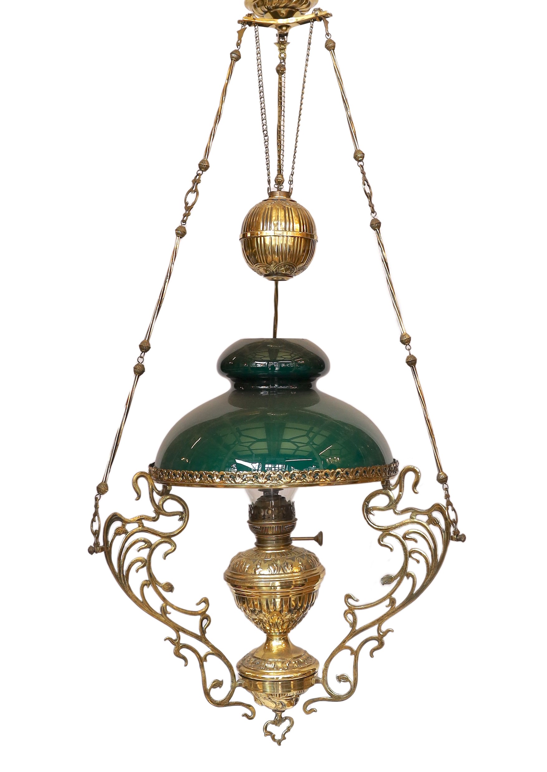 A 19th century French embossed brass counterbalanced hanging oil lamp with opaque glass shade, height 110cm. width 50cm